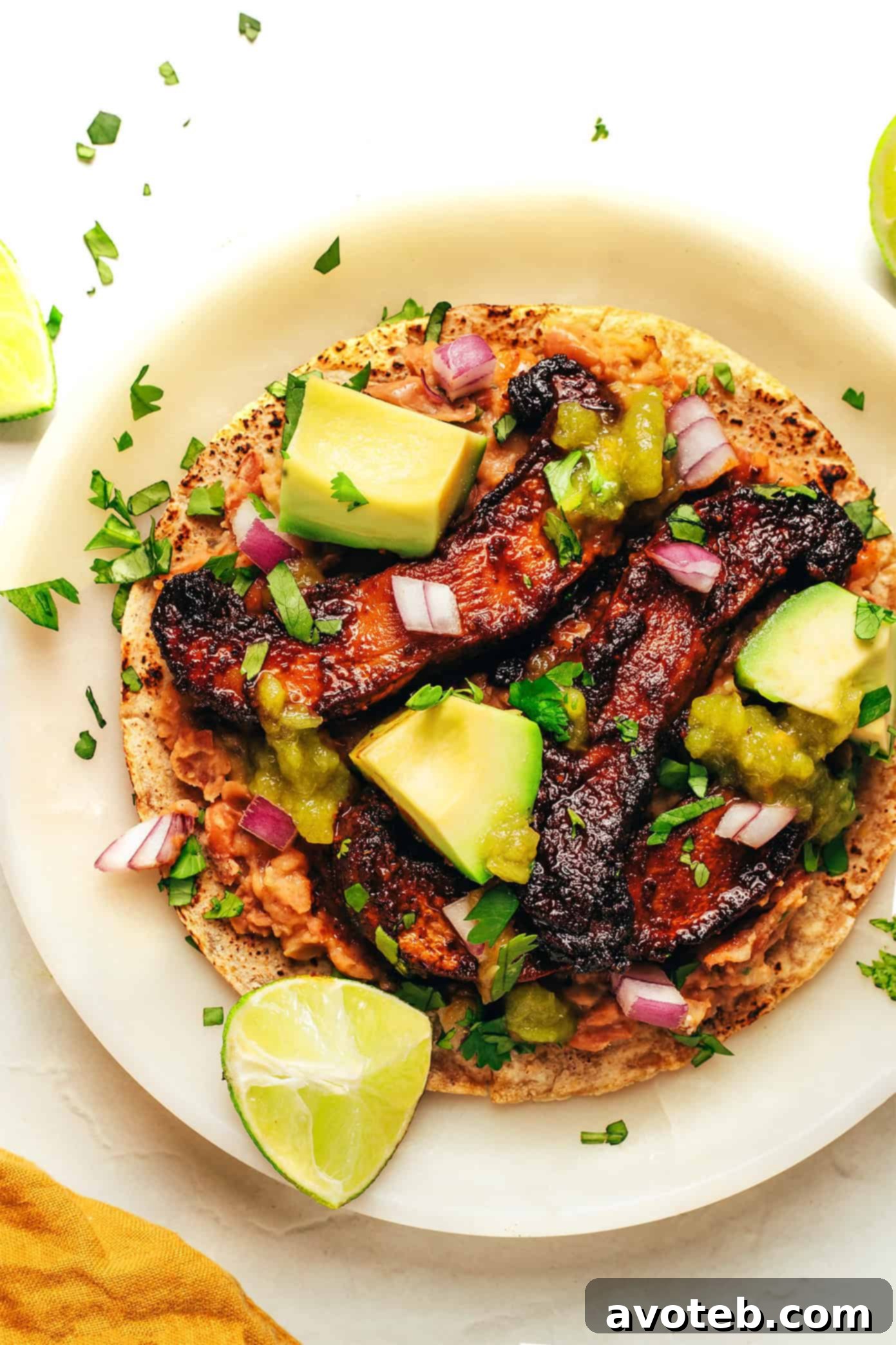 A close-up of Portobello Mushroom Tacos, highlighting the texture and fresh ingredients.