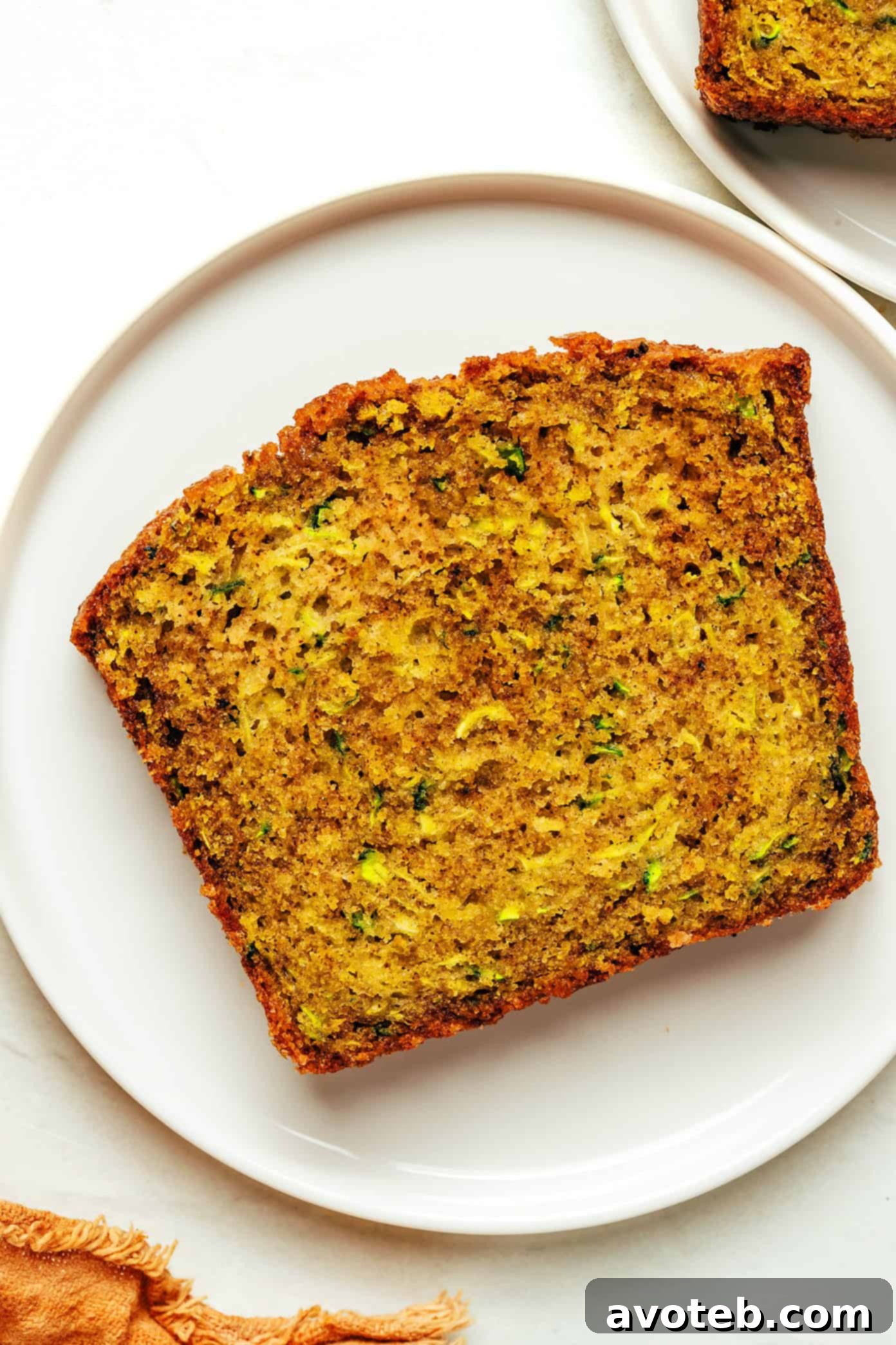 A whole loaf of zucchini bread, perfectly baked with a golden crust
