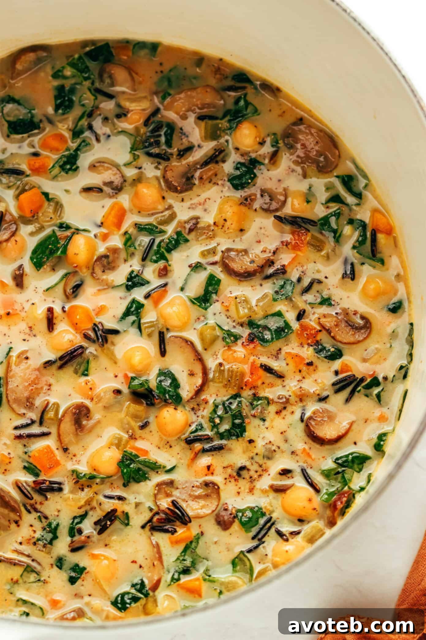 Pumpkin wild rice soup simmering on the stove