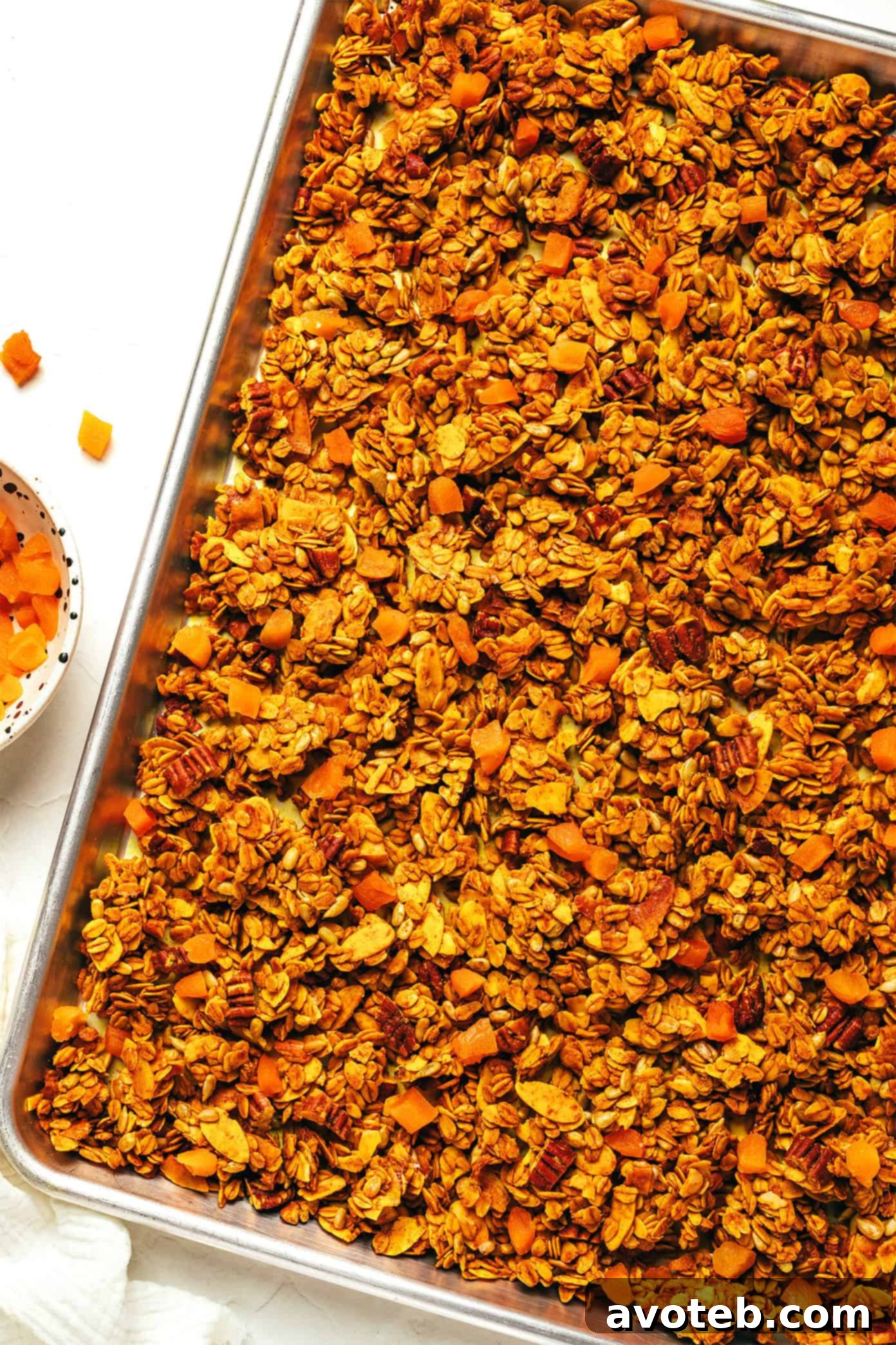 Golden Granola in a large glass jar, ready for storage