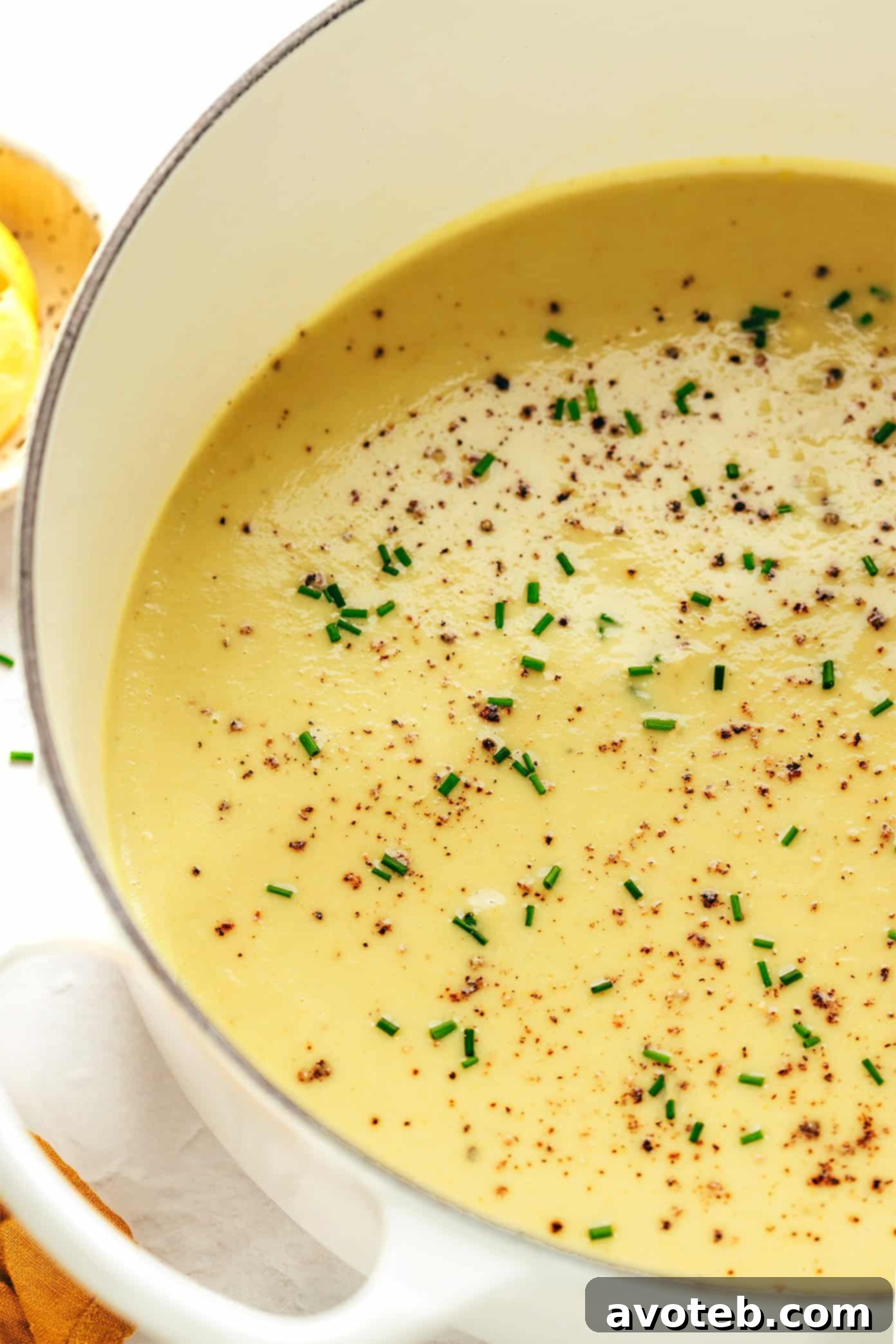 A large pot of creamy celery soup simmering on the stovetop, ready for blending.