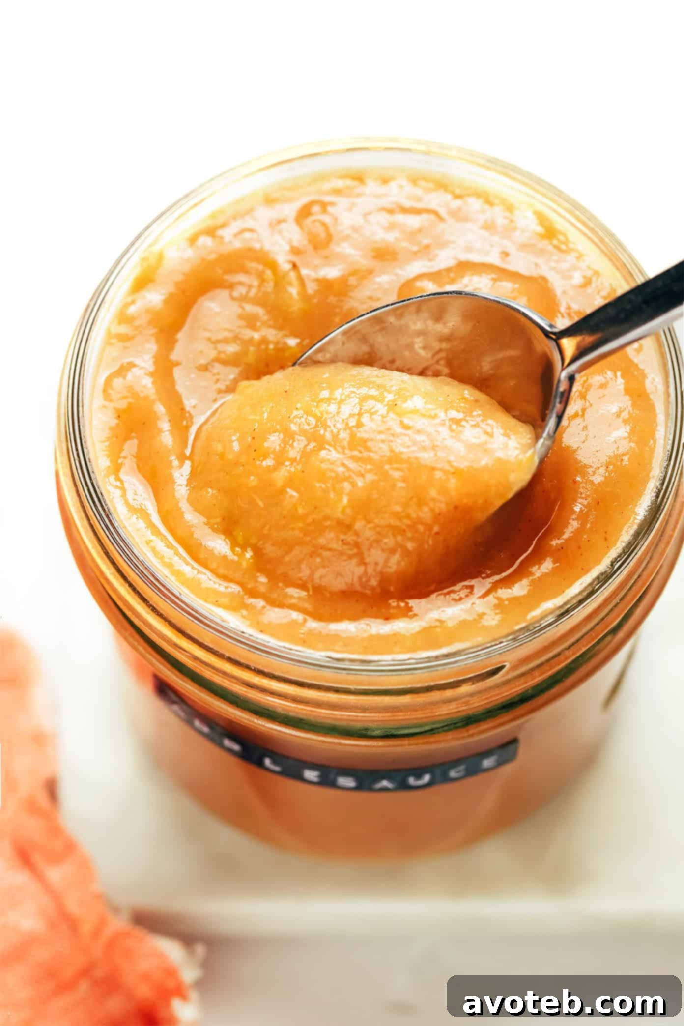 Homemade Instant Pot applesauce in a bowl with cinnamon stick