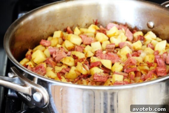 Corned Beef Hash | Quick and Easy Recipe A close-up shot of crispy, golden Corned Beef Hash, showcasing its texture and delicious appeal.