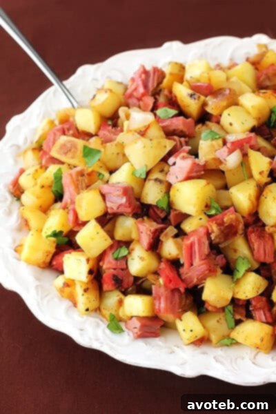 Corned Beef Hash | Best Way to Use Leftovers A top-down view of the freshly cooked Corned Beef Hash, garnished and ready to be served.