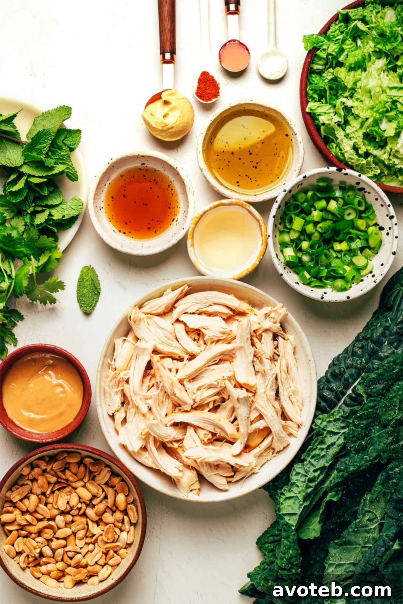 Close-up of Kale Peanut Chicken Salad, showcasing the dressing and fresh ingredients