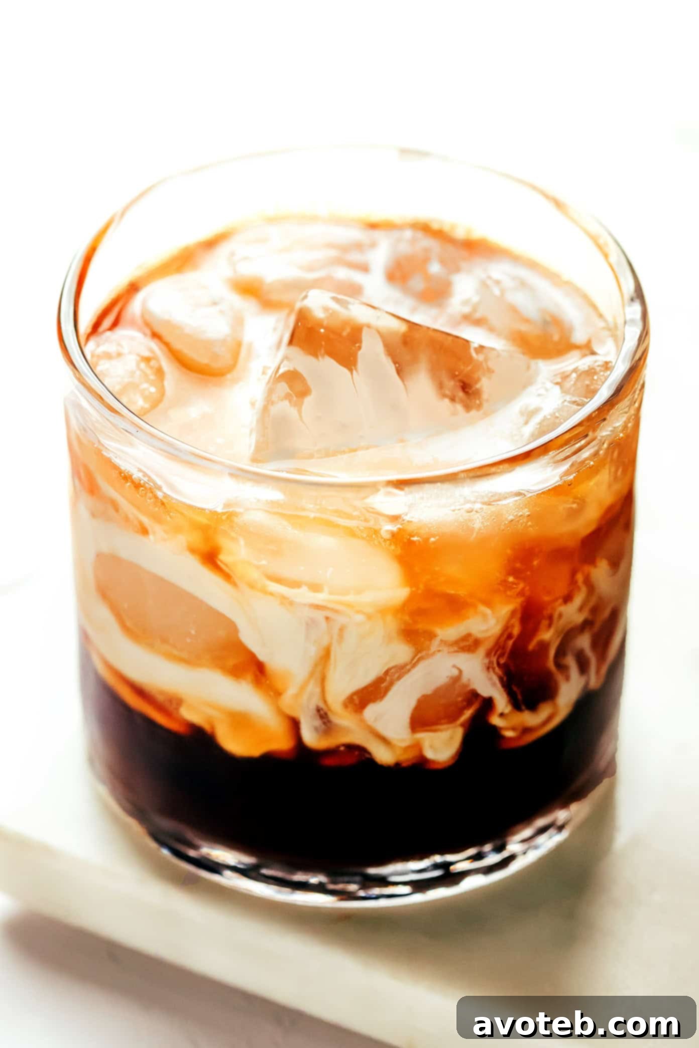 A final shot of a perfectly mixed White Russian cocktail, ready to be enjoyed