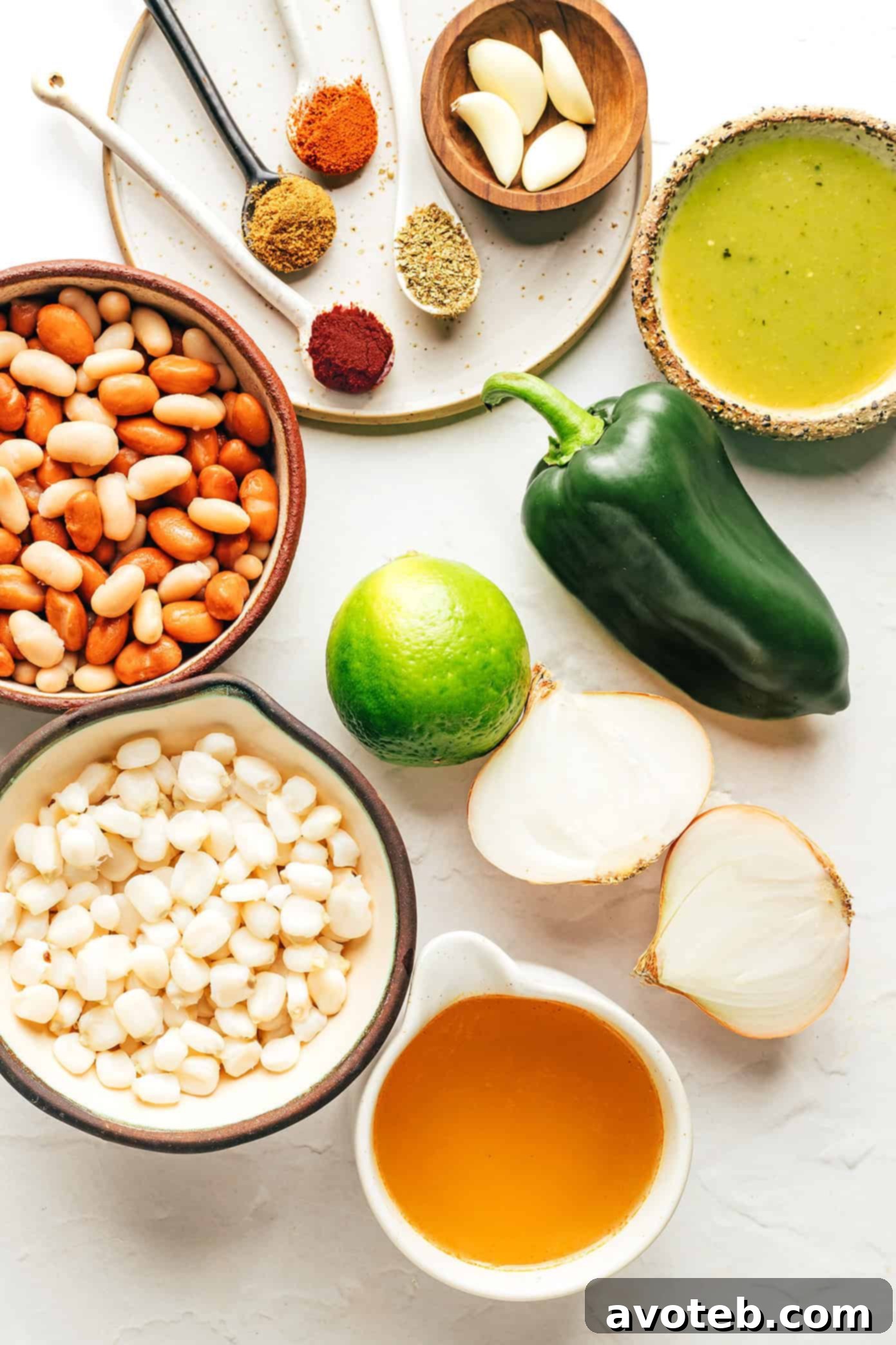 Close-up shot of the vegetarian pozole simmering in a large pot, showcasing the rich broth, hominy, and beans.