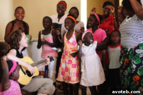 Children and adults singing and playing music together in Zambia.