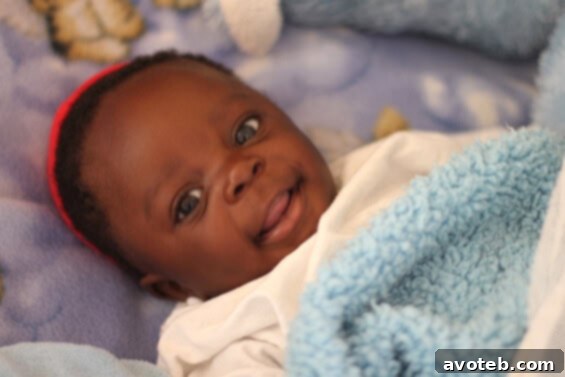 Baby Will, a miracle child, rescued from a pit latrine, smiling at the orphanage.