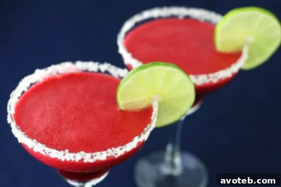 Refreshing Blackberry Lime Margaritas with fresh fruit and lime slices, perfect for summer celebrations.