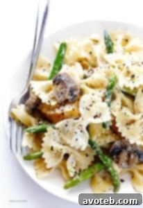 A vibrant bowl of Goat Cheese Pasta with Chicken, Asparagus & Mushrooms