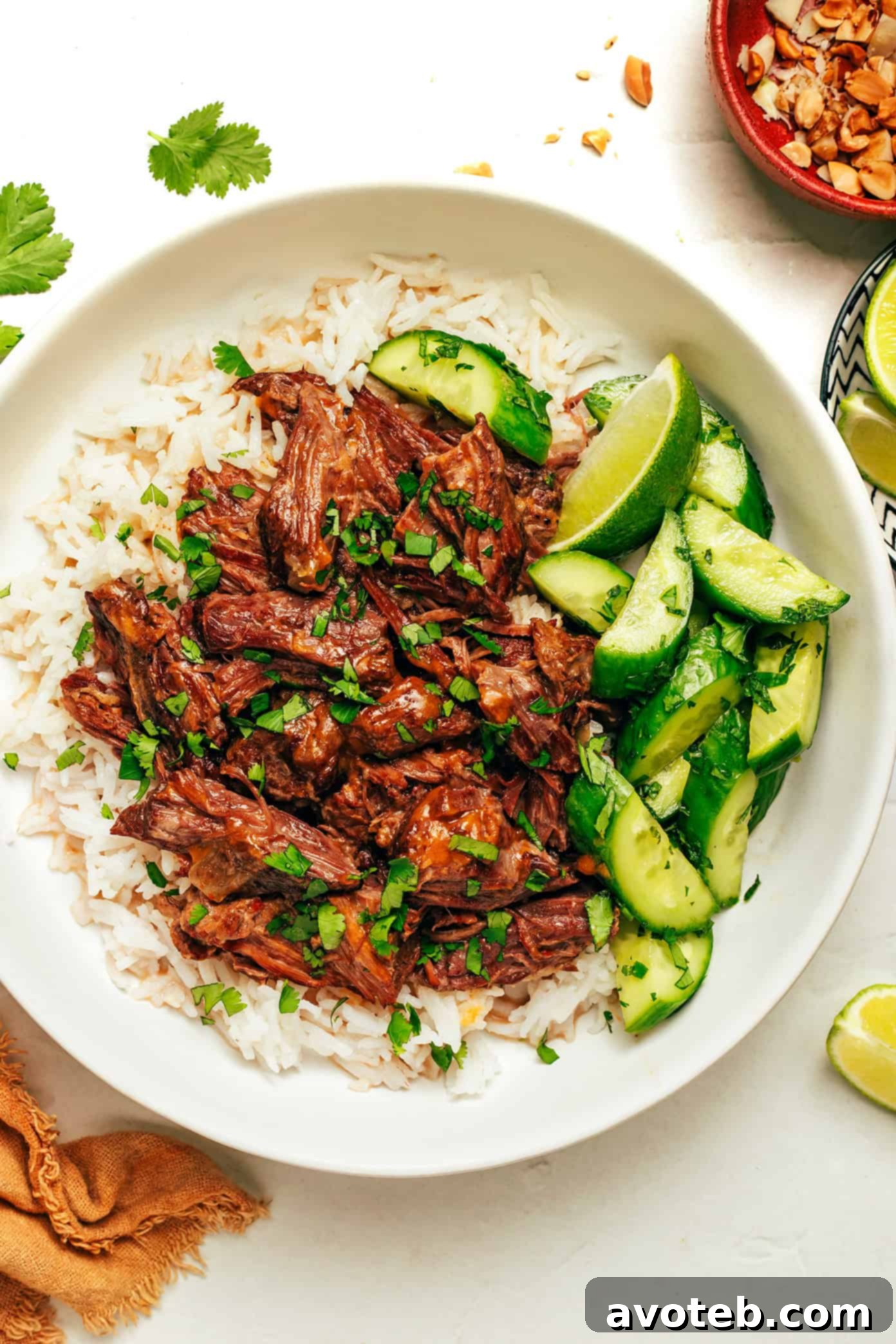 Ingredients laid out for making Coconut Curry Shredded Beef, including beef, spices, and fresh vegetables.
