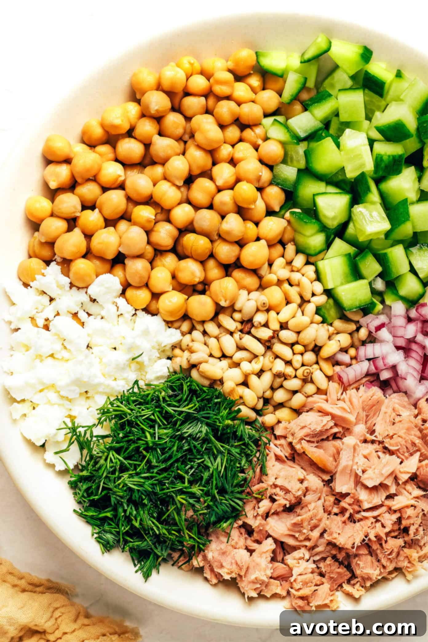 Close-up shot of the finished Lemon Tahini Chickpea Tuna Salad, showcasing its vibrant ingredients and inviting textures, ready to be served.