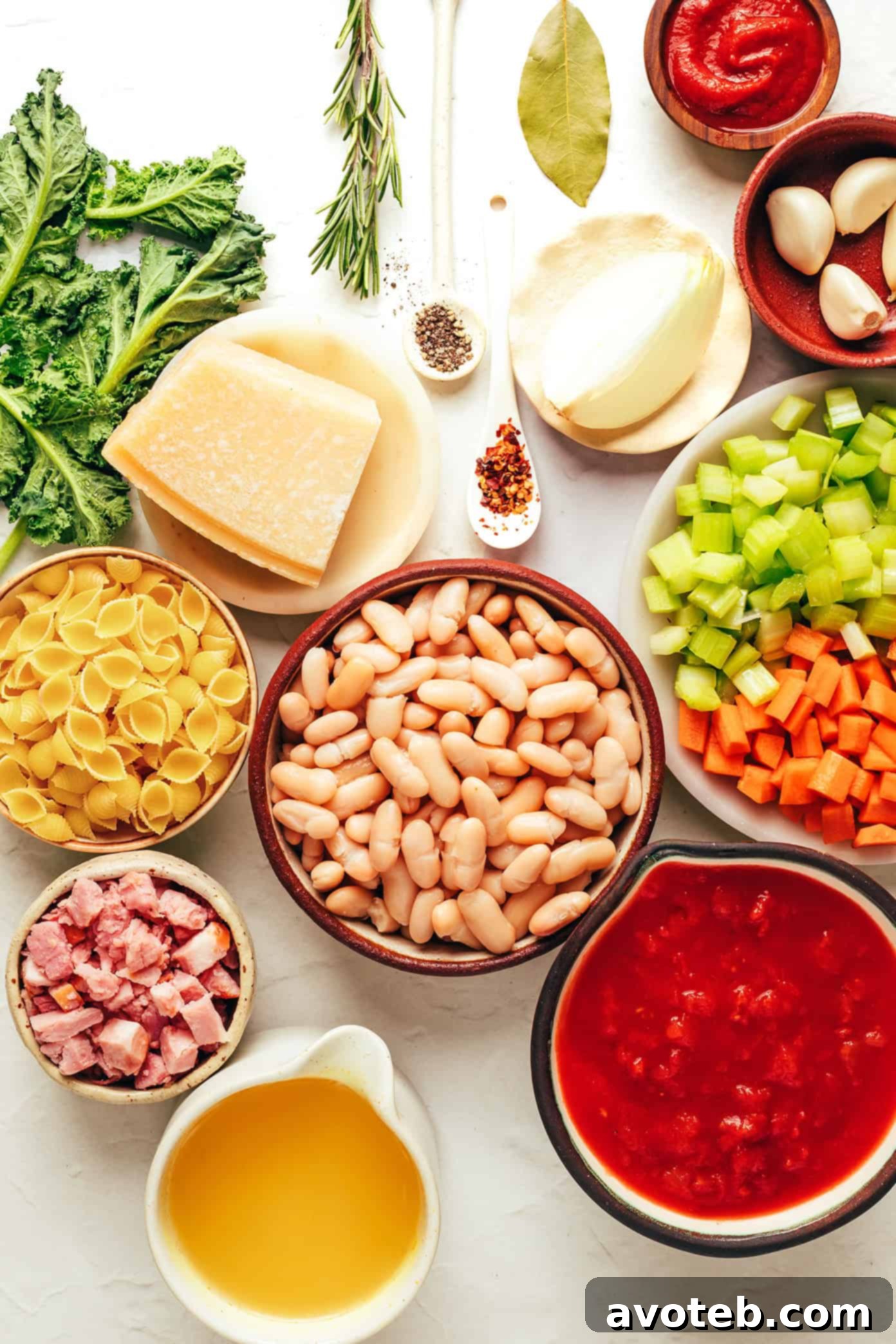 Close-up photo of a rustic bowl of Pasta e Fagioli, showing the pasta, beans, and rich, red broth.