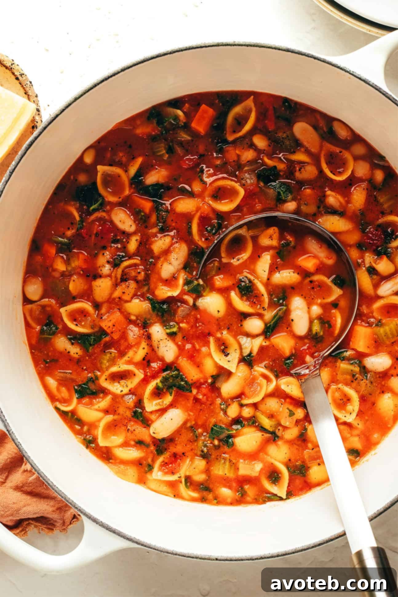 A large pot of freshly cooked Pasta e Fagioli, garnished and ready to be served into individual bowls.