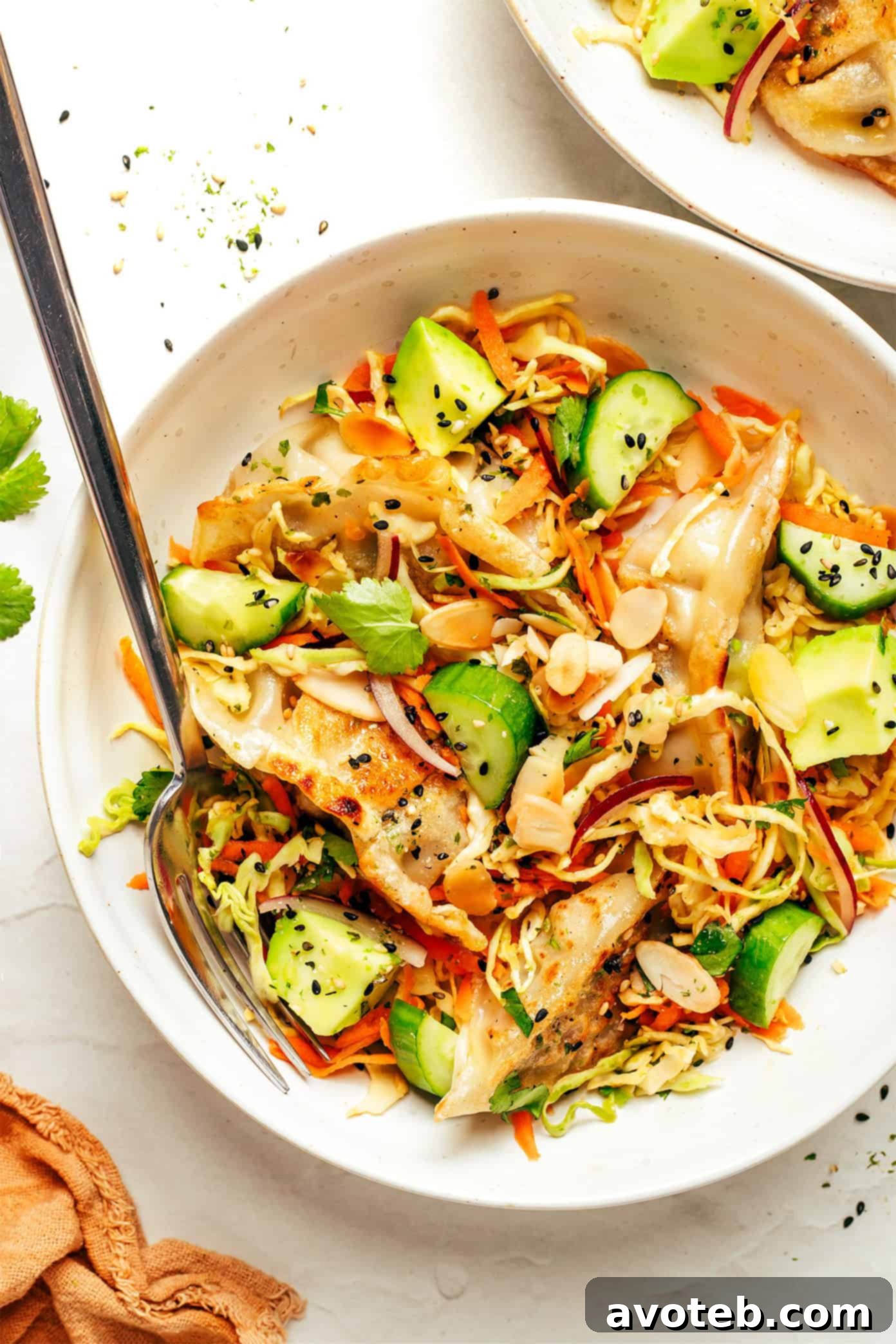 Potsticker Salad with crispy gyoza, fresh vegetables, and sesame-ginger dressing