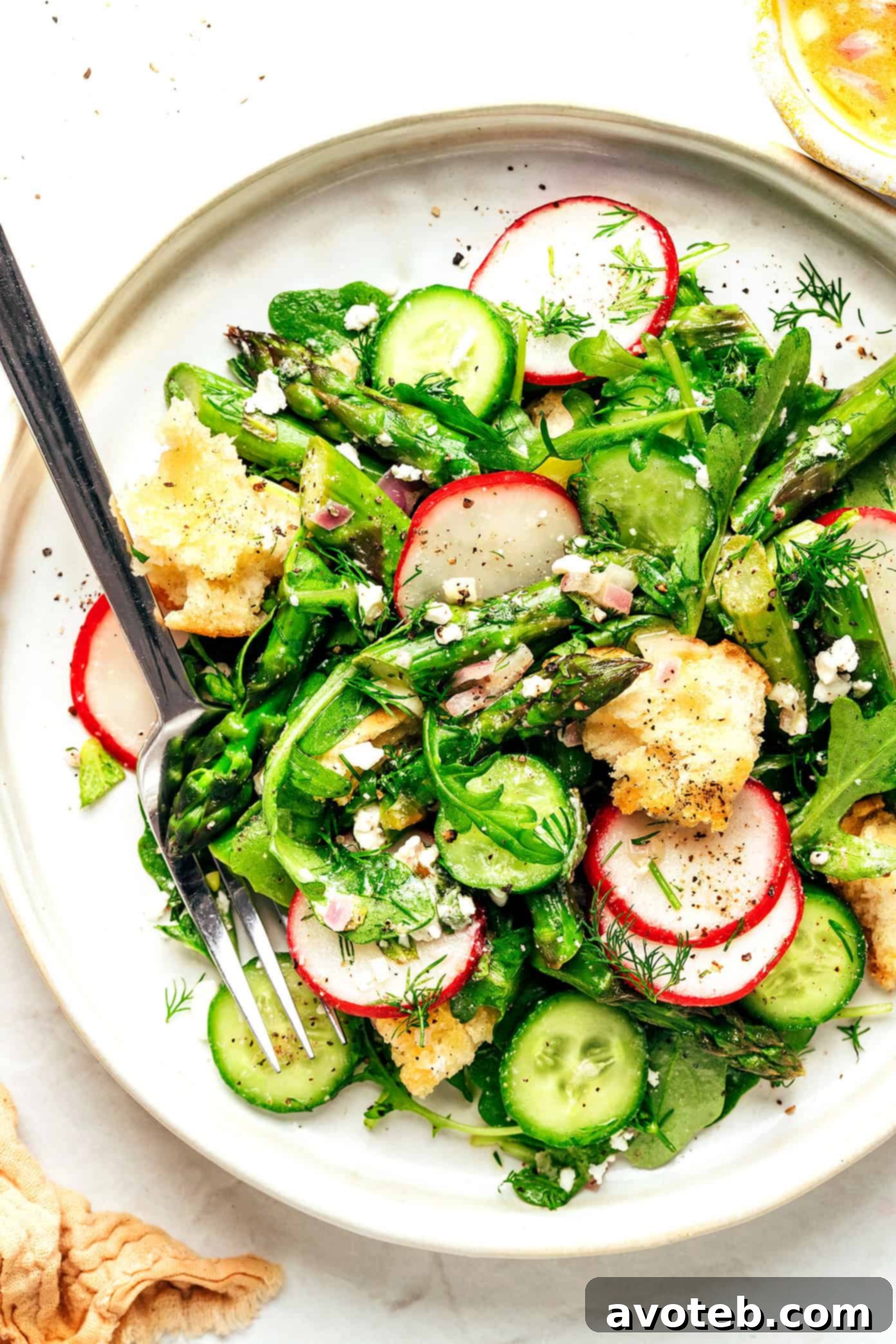 Spring Panzanella Salad beautifully presented on a plate
