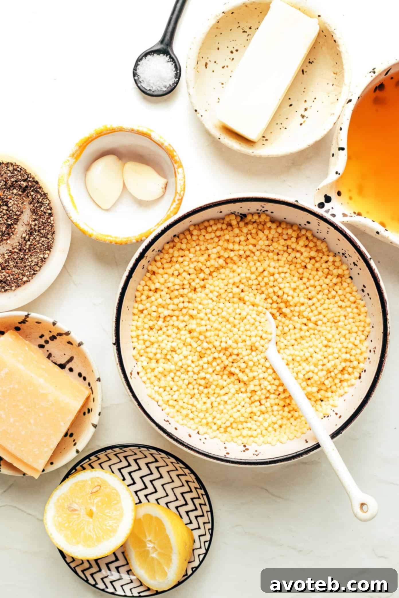 A collage of ingredients for Lemon Parmesan Pearl Couscous displayed on a wooden board.