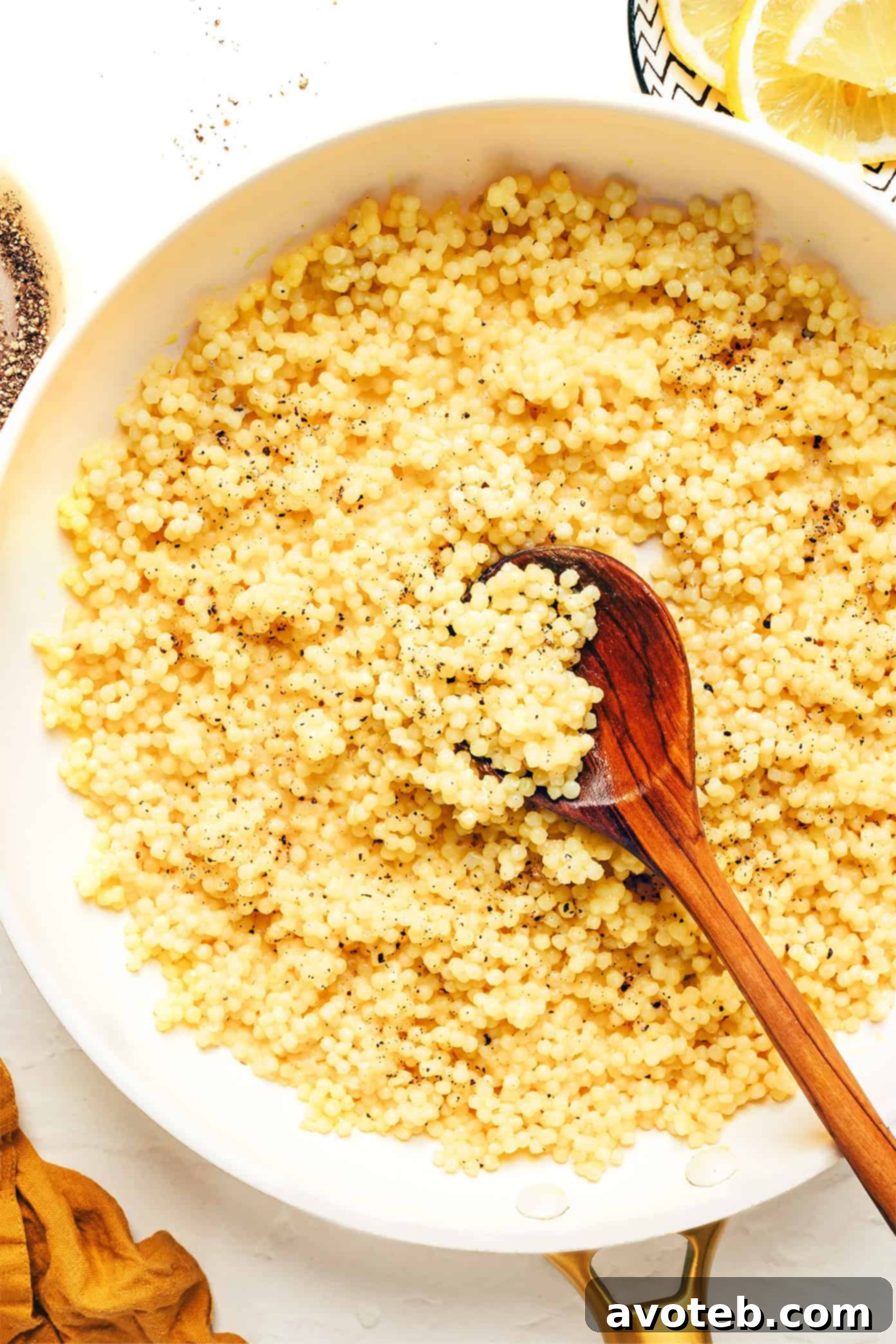 A large skillet filled with creamy Lemon Parmesan Pearl Couscous, ready to be served.