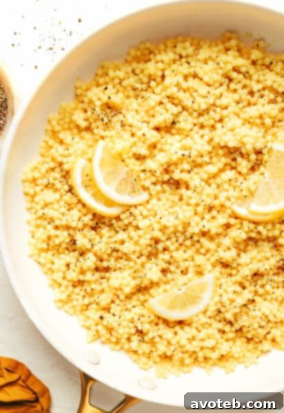 Lemon Parmesan Pearl Couscous, perfectly cooked and garnished, ready to be served from a bowl.