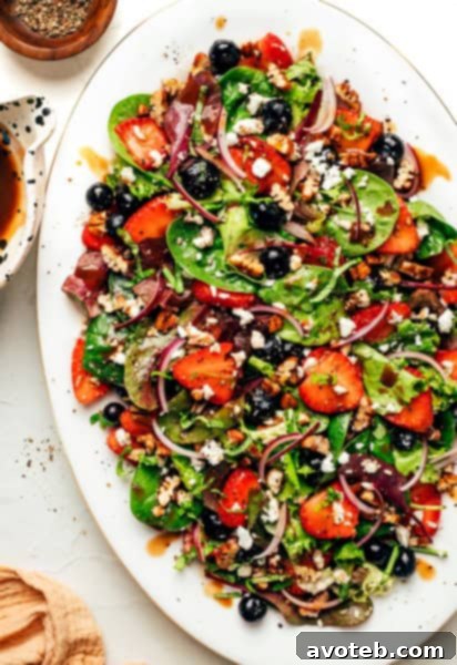 Balsamic Berry Salad recipe image, a vibrant mix of berries and greens.