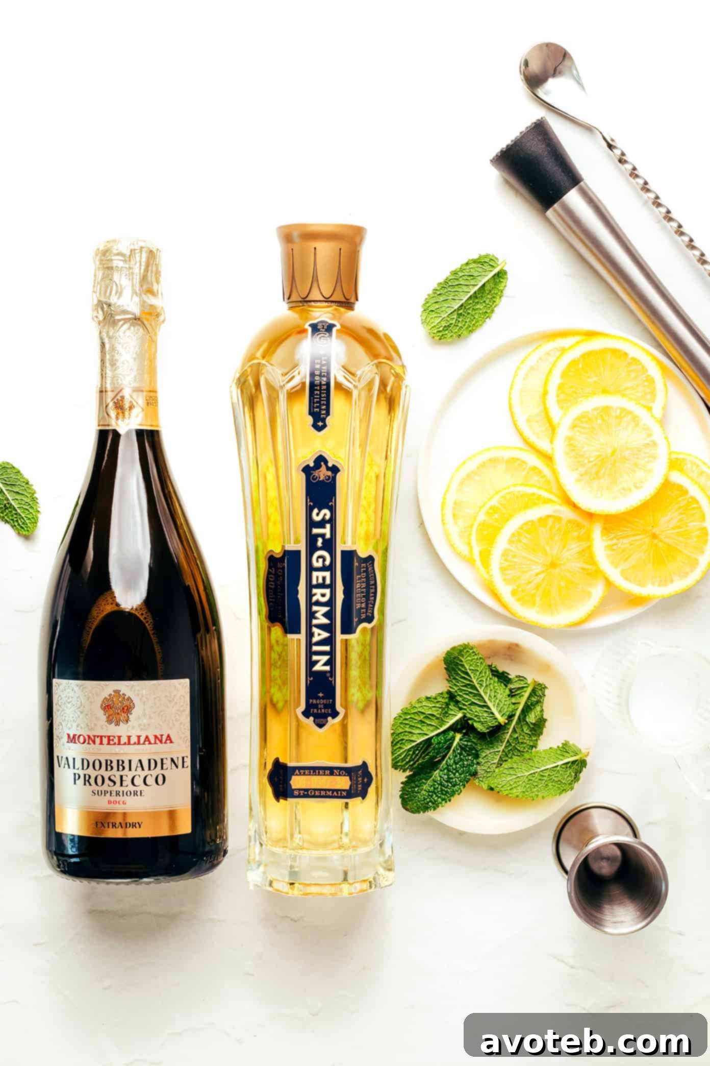 Ingredients for Hugo Spritz: elderflower liqueur, prosecco, soda water, mint, and lime