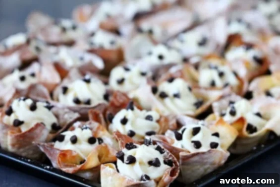 Freshly made Cannoli Cups dusted with powdered sugar, ready for serving.