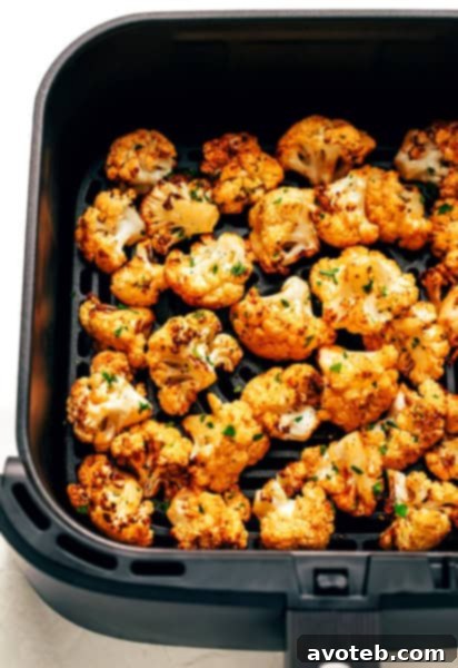Crispy Air Fryer Cauliflower on a plate with fresh parsley