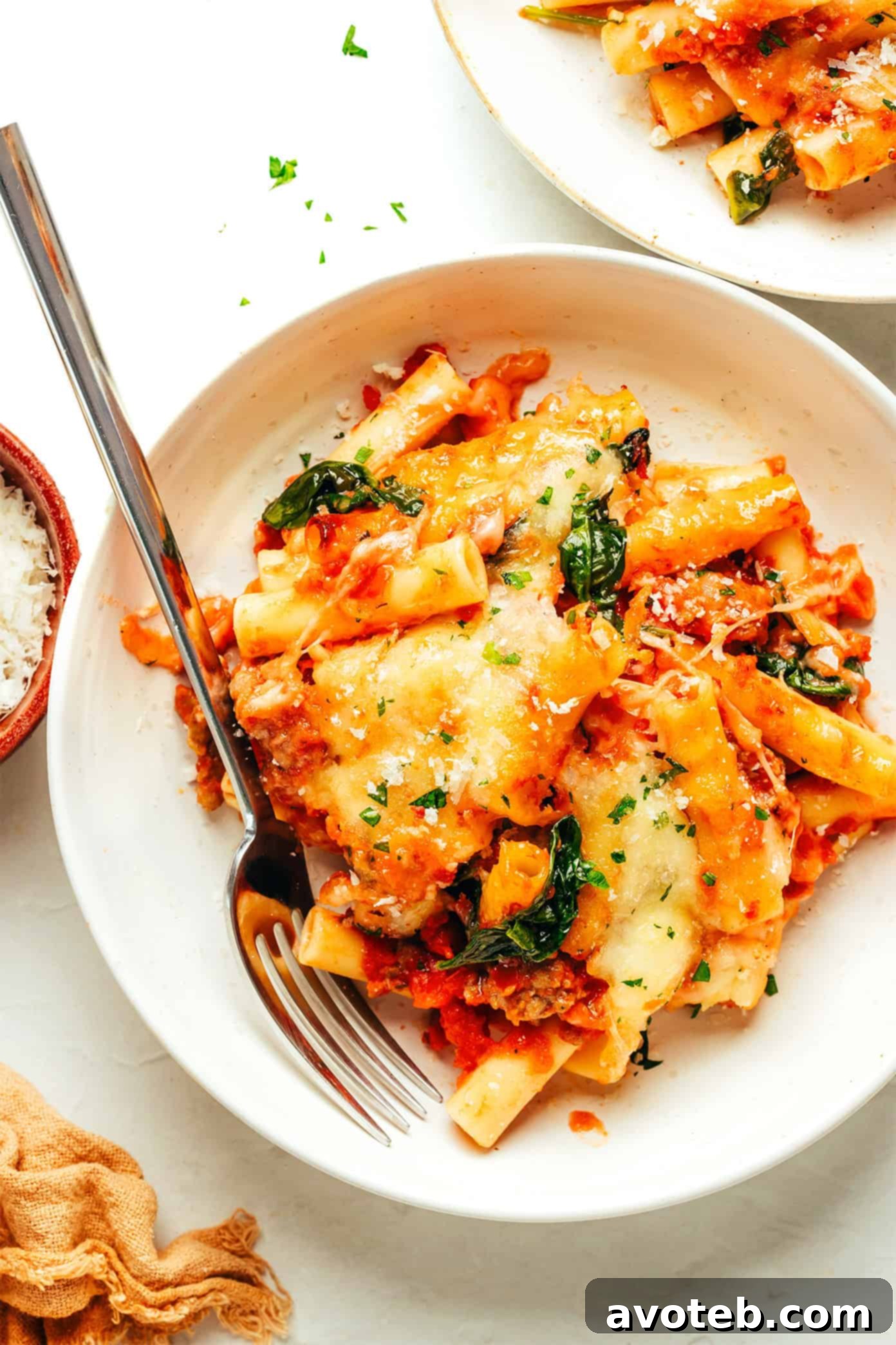 Close-up of baked ziti with a serving removed