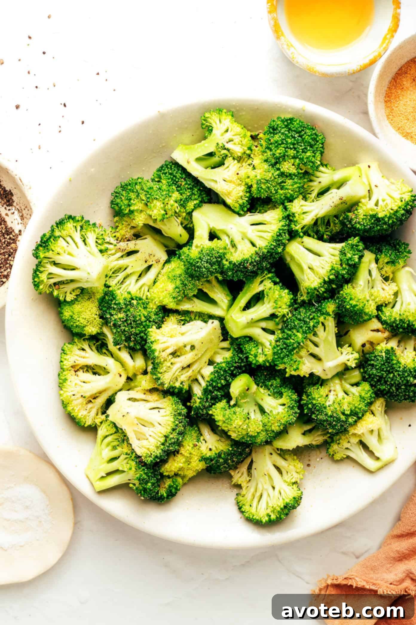 Close-up of seasoned broccoli florets before air frying