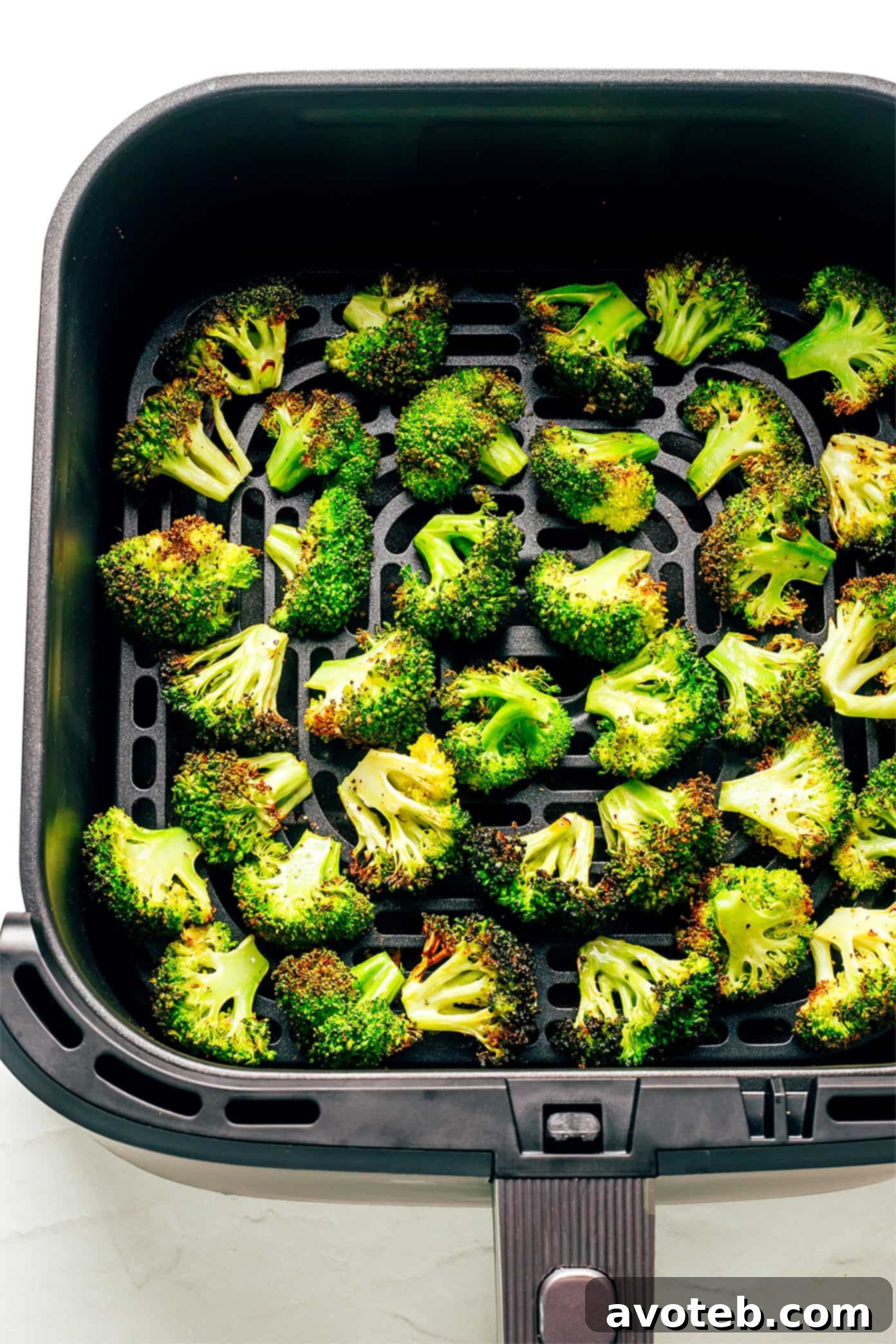 Air fried broccoli with lemon wedges