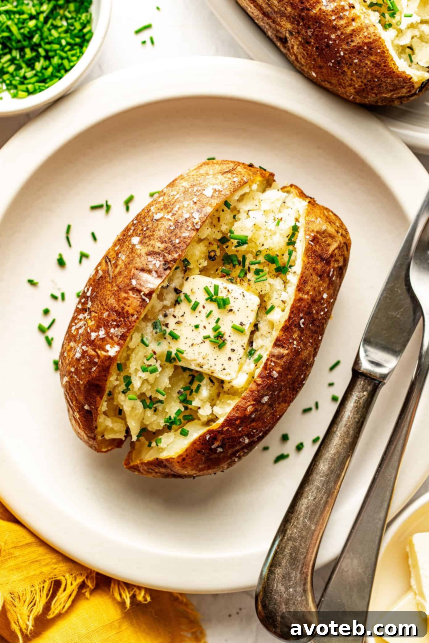 air fryer baked potato with butter and chives