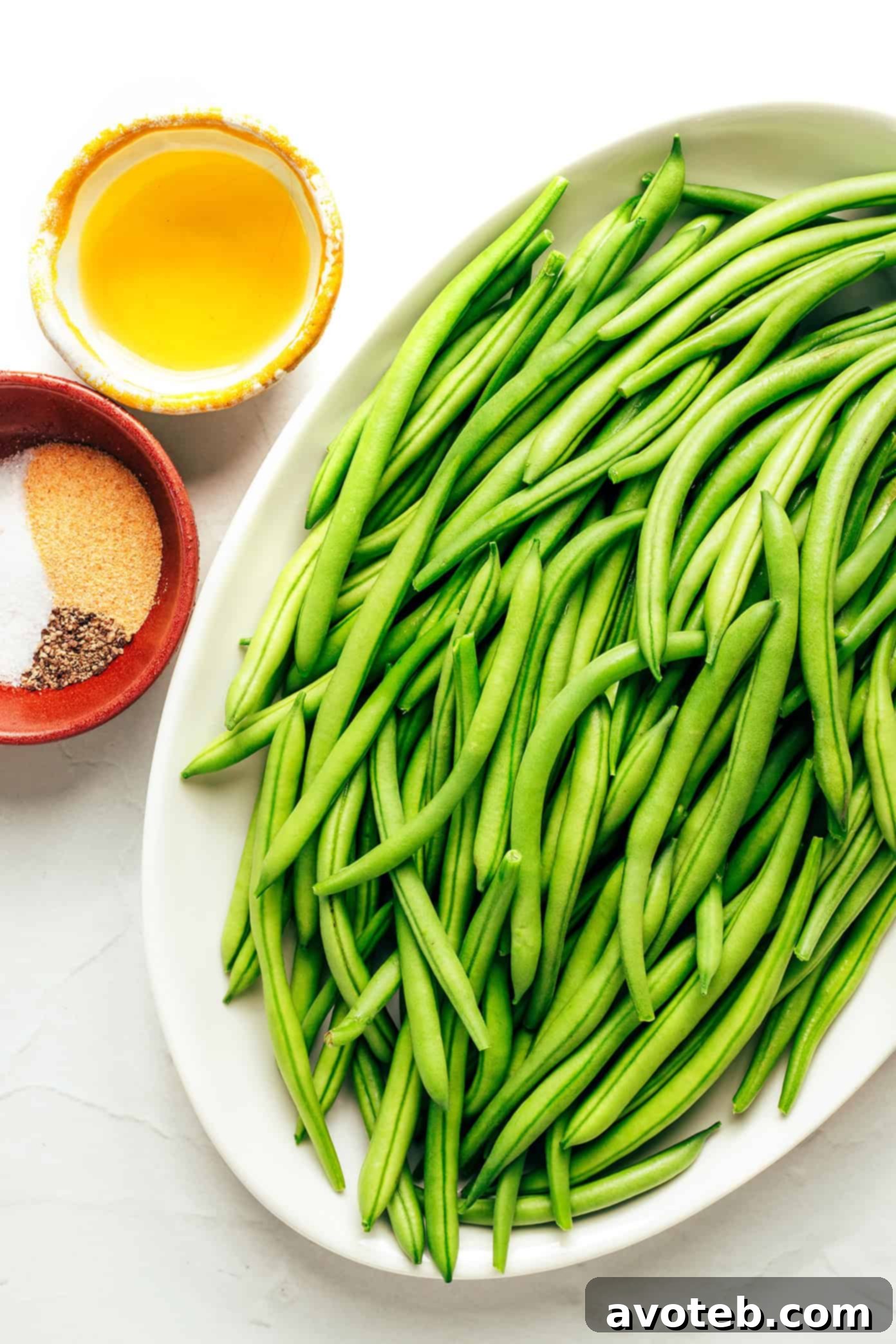 Close-up of air fried green beans in an air fryer basket