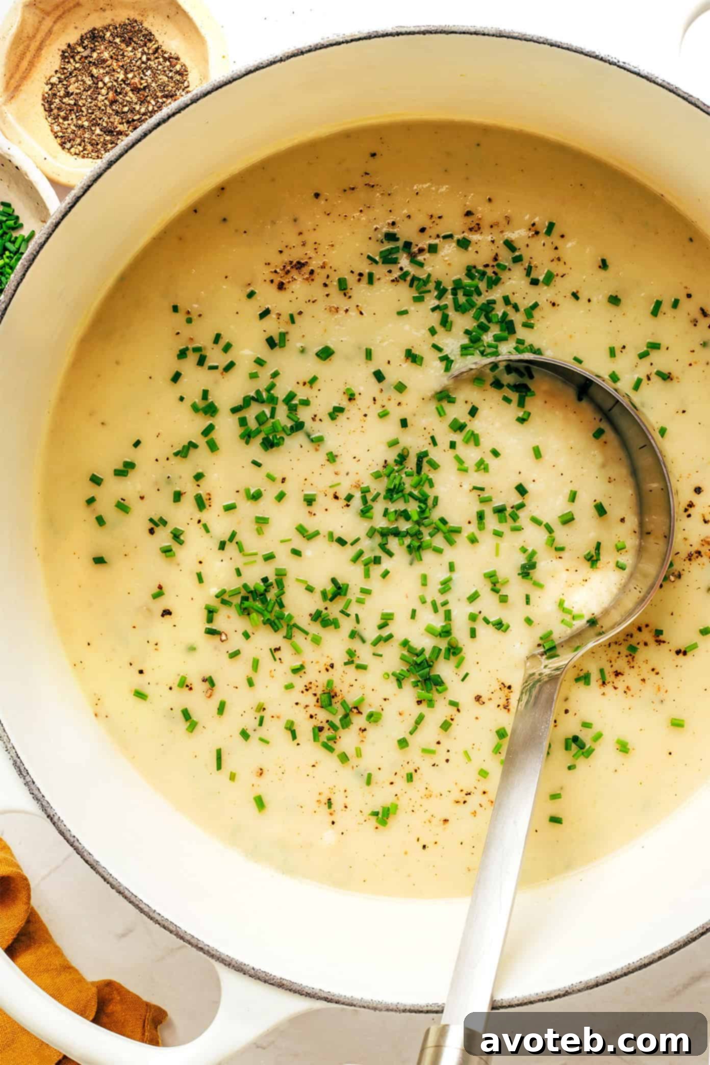 Creamy Potato Leek Soup in a bowl with fresh chives