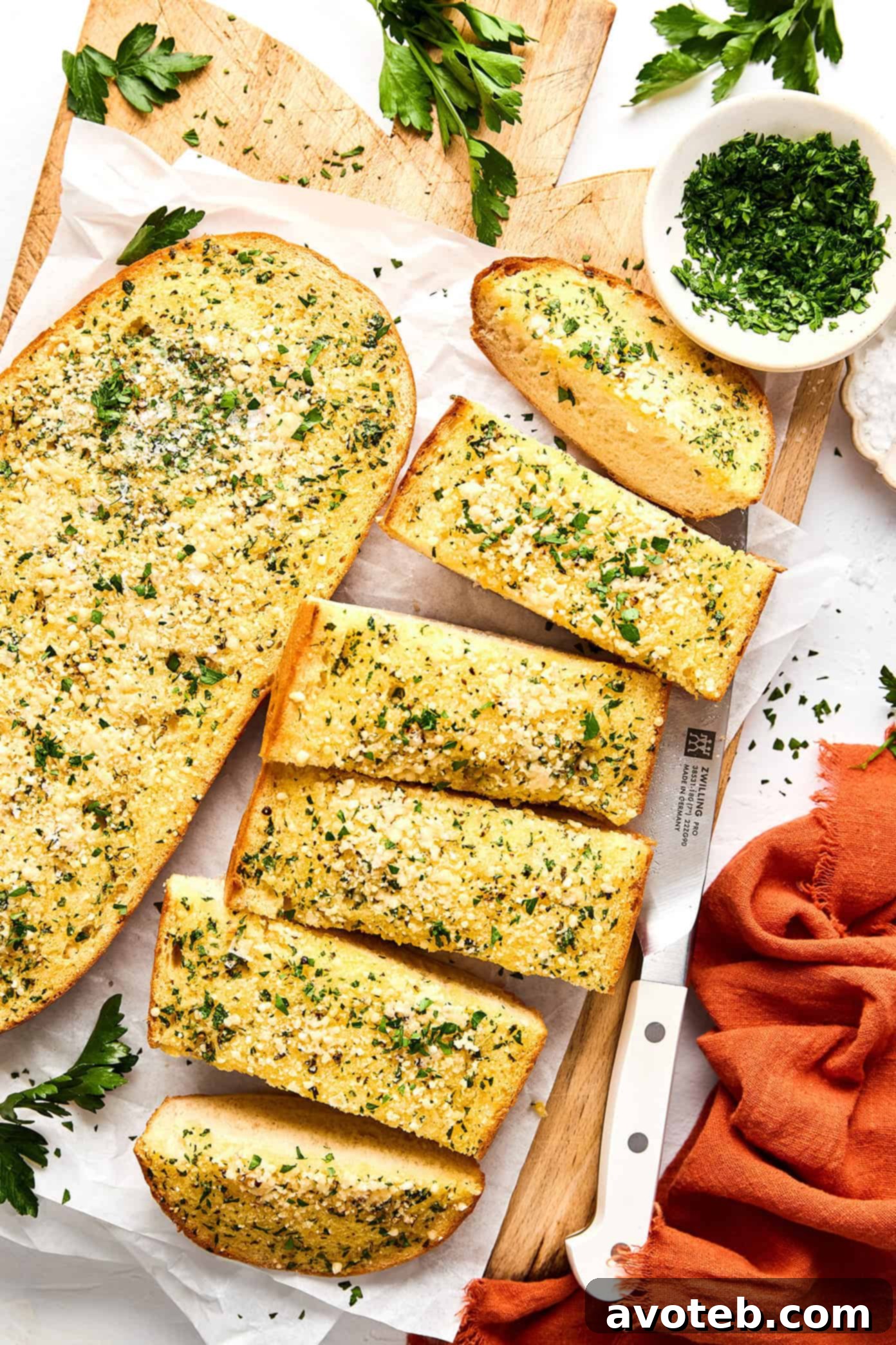 Close-up of garlic bread slices on a cutting board