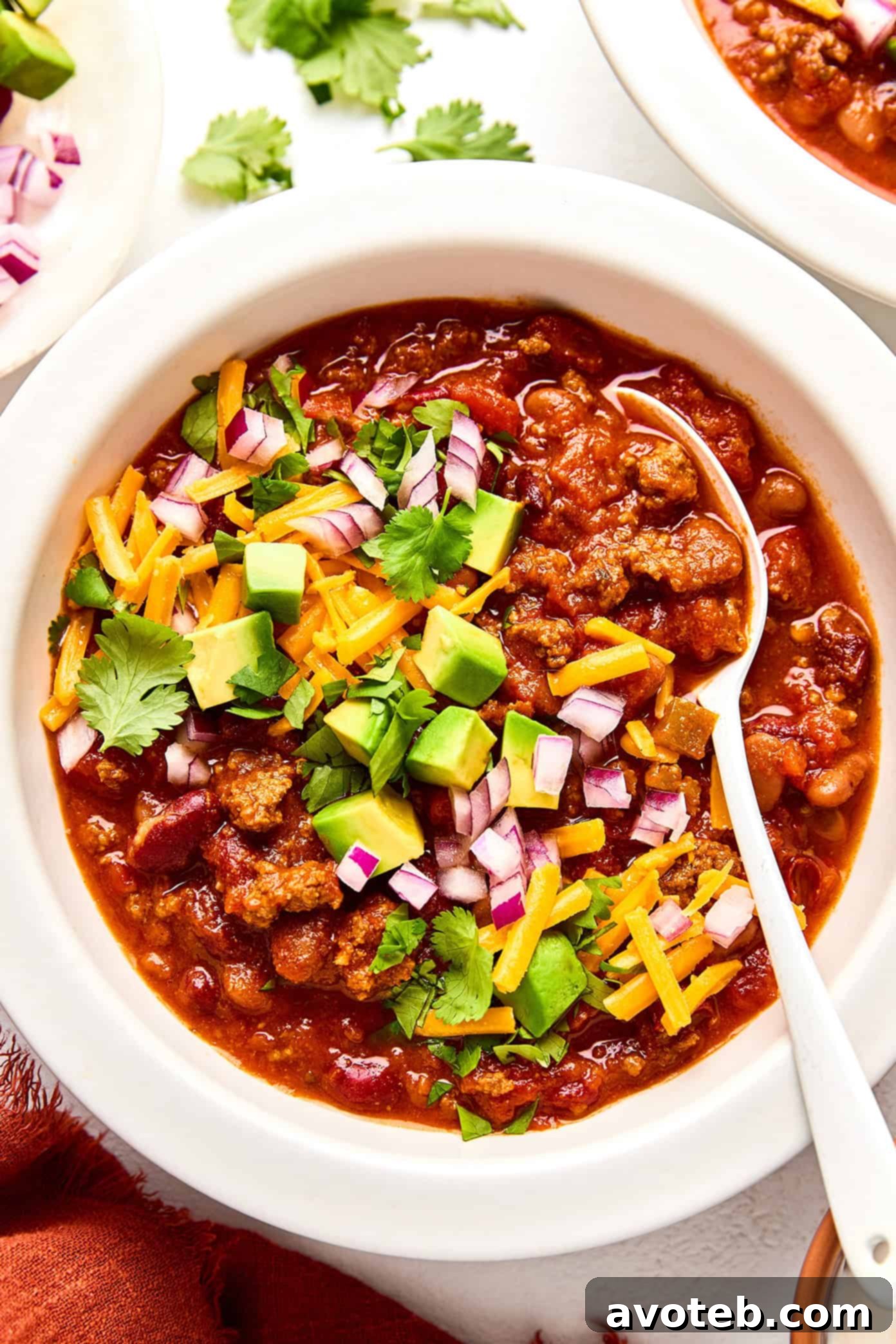 A final, mouth-watering image of the chili, garnished and ready for serving, emphasizing its inviting and delicious appearance.