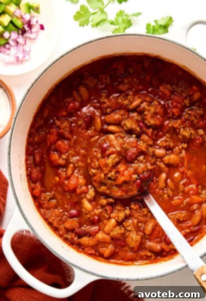 A vibrant bowl of 5-ingredient chili with toppings, highlighting the ease and deliciousness of the recipe.