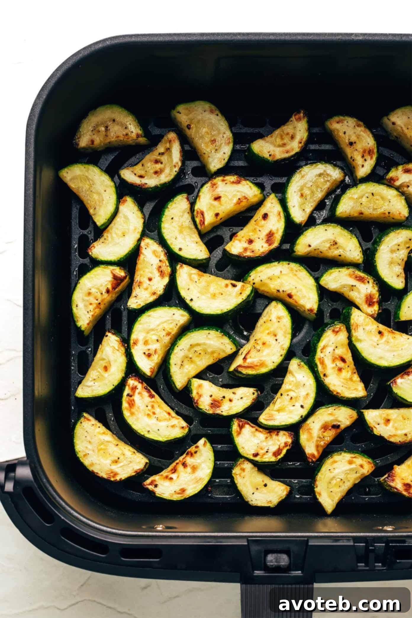 Air fryer basket with zucchini