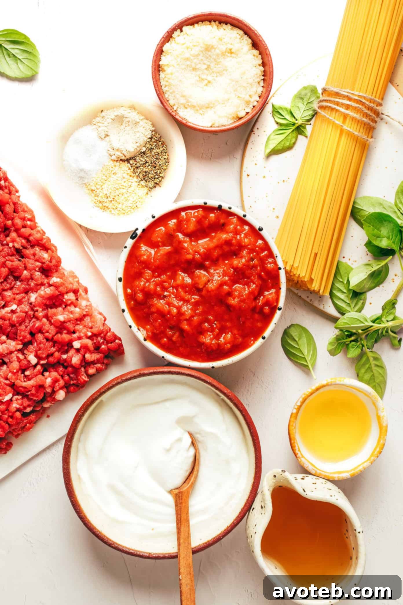 A serving of High Protein Instant Pot Spaghetti with a fork, garnished with fresh herbs.