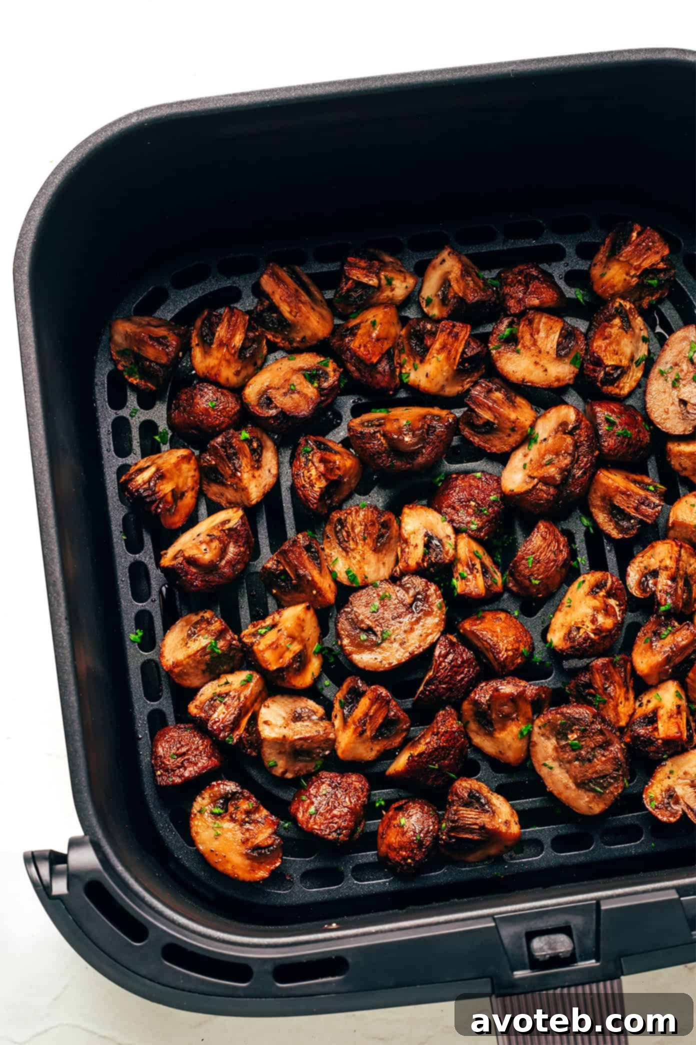 Air fryer mushrooms styled beautifully in a serving dish.