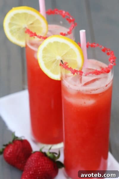 Sparkling Strawberry Lemonade with Pop Rocks - Gimme Some Oven Close-up of Sparkling Strawberry Lemonade with Pop Rocks rim