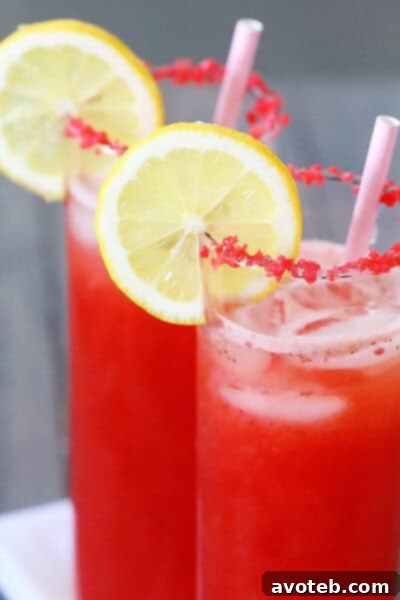 Best Sparkling Strawberry Lemonade - Gimme Some Oven Refreshing glass of Sparkling Strawberry Lemonade outdoors