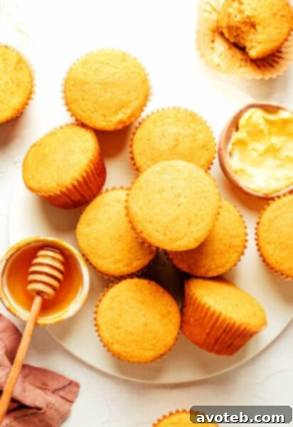 Honey Cornbread Muffins with a drizzle of honey and butter
