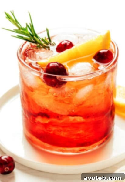 A beautifully garnished Cranberry Aperol Spritz recipe card image.