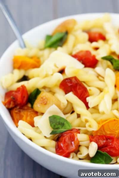 A beautifully plated dish of Slow-Roasted Tomato, Garlic & Parmesan Pasta, ready to be enjoyed