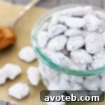 Biscoff Puppy Chow with a crispy, powdered sugar coating