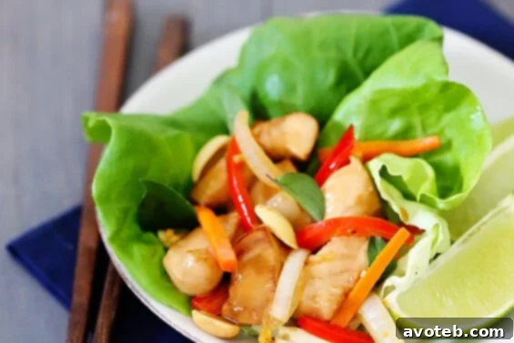 Delicious Thai Basil Chicken Lettuce Wraps, a healthy and quick meal perfect for summer.