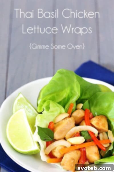 A beautifully arranged platter of Thai Basil Chicken Lettuce Wraps, garnished and ready to be served.
