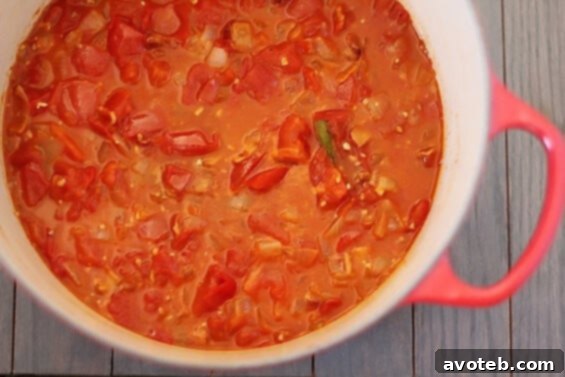 Close-up of Roasted Tomato Bacon Soup, showcasing its rich texture and color, garnished for serving.
