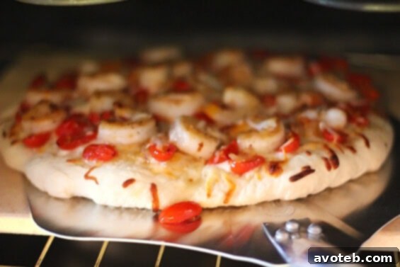 Shrimp and tomato topping on pizza
